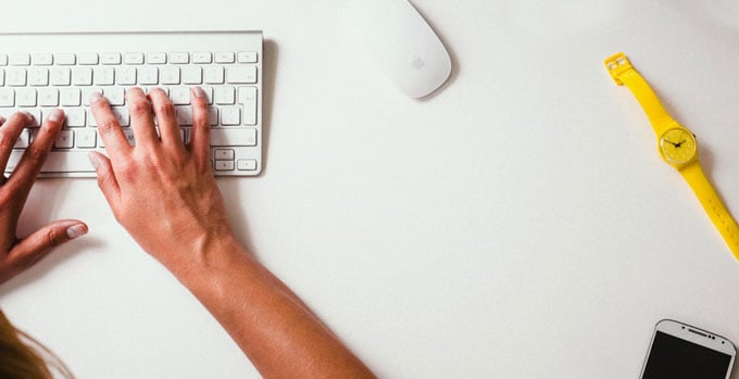 person typing on a keyboard