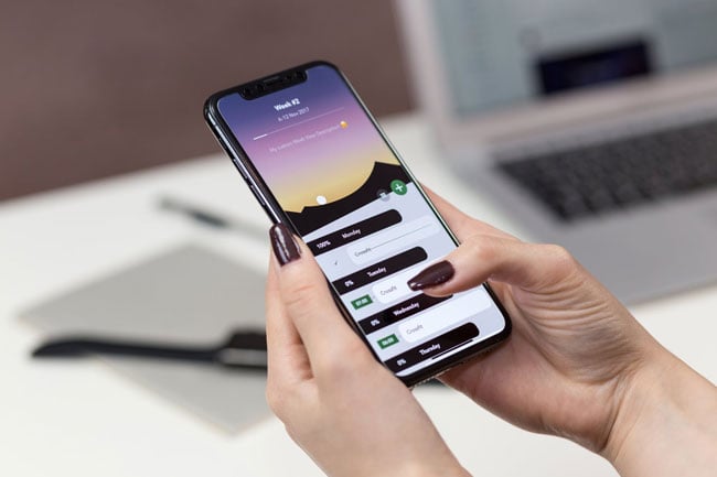 a woman makes an appointment on a smartphone