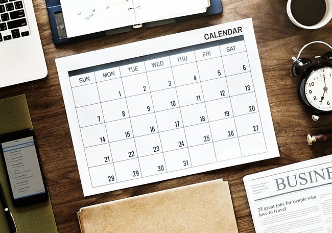 a blank calendar on a desk
