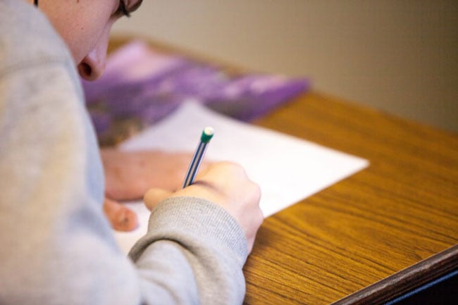 student filling out paperwork