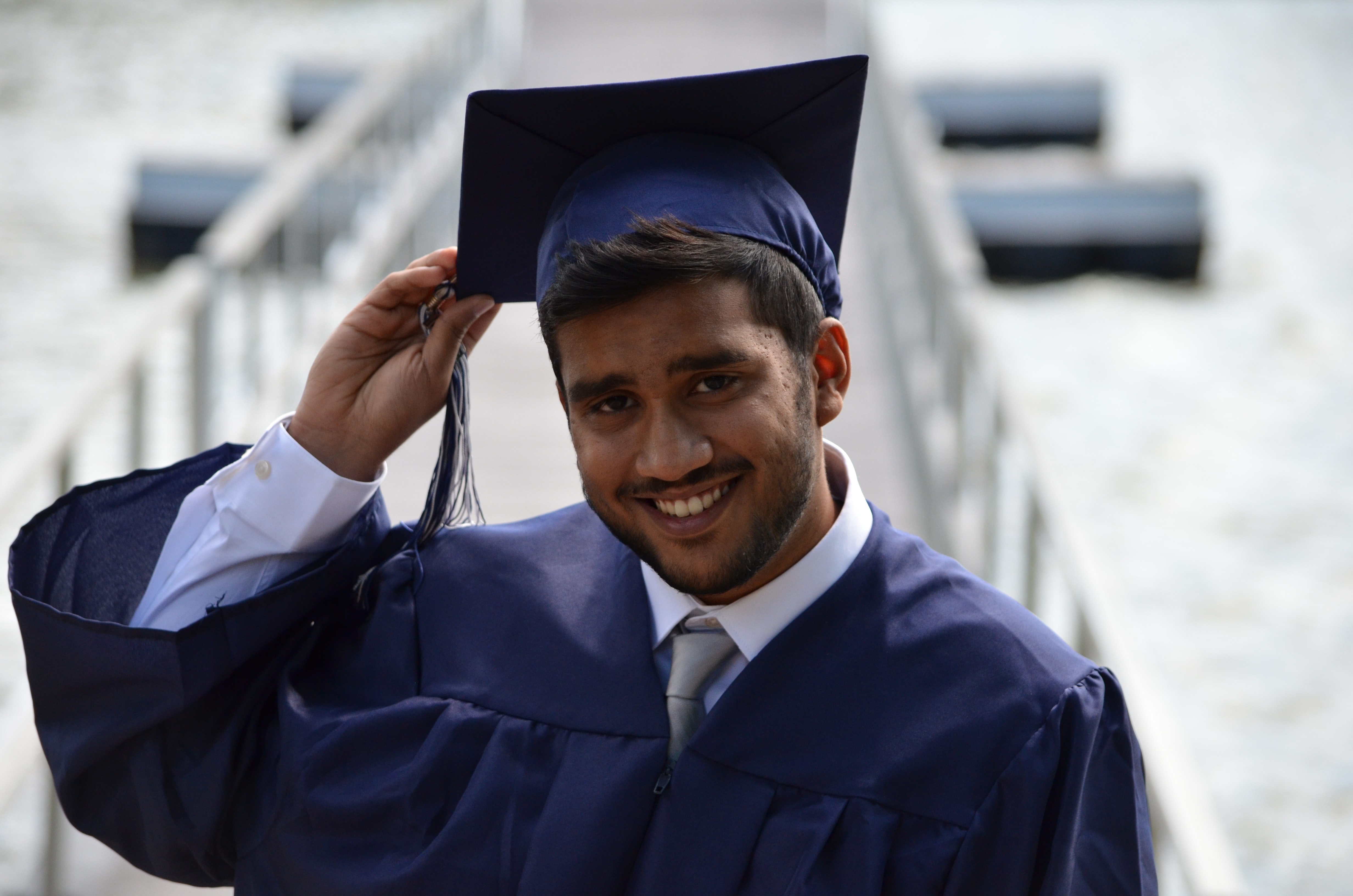 male college graduate in cap and gown