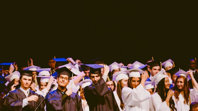 graduates move their tassels
