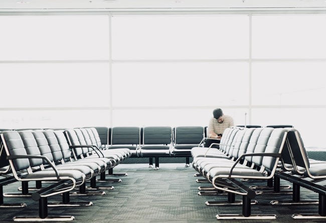man sits in an empty waiting room