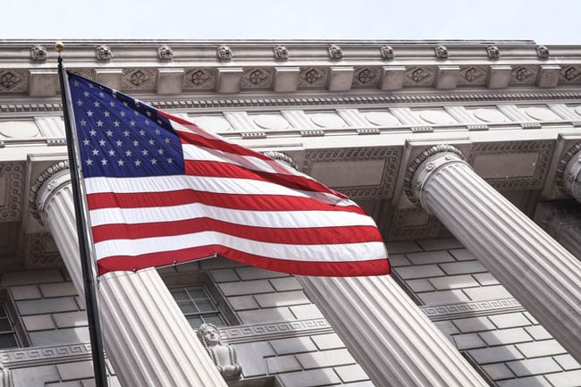 flag flies in front of a municipal building