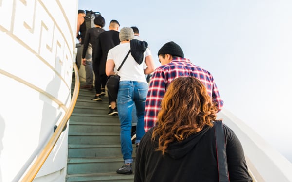 People waiting in line on a stairway