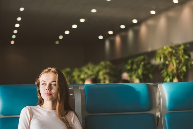 Woman waiting in a waiting room.