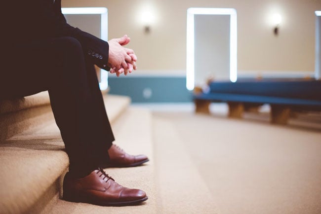 man waits in a waiting room