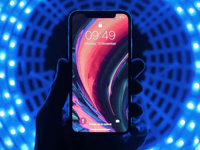 a mobile device held in a hand