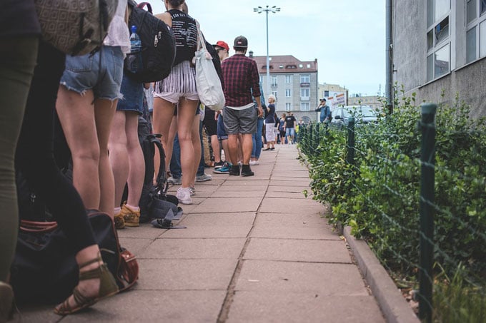 people stand in a long line
