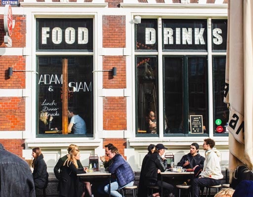People sitting and drinking at a restaurant