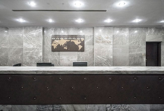 a reception desk stands empty