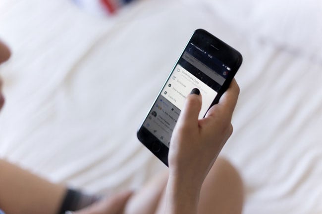 woman makes an appointment on a smartphone