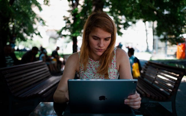 women visits a website on her laptop