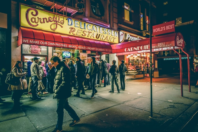 People waiting in front of a restaurant