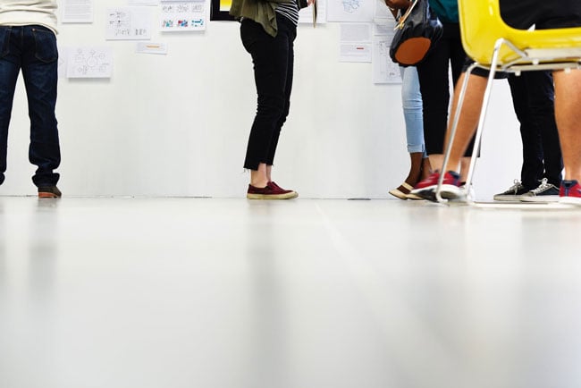 a group of students stand in line